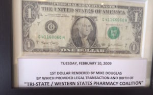 Commemorative Dollar Bill Presented to Michael Douglas, framed, with text inscription: "Tuesday, February 10, 2009. 1st Dollar Rendered by Mike Douglas by which provided legal transaction and birth of Tri-State/Western States Pharmacy Coalition."
